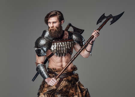 Assaulting viking soldier with axe dressed in armour with furの写真素材