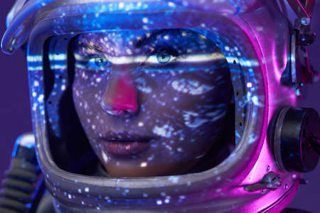 Portrait of female astronaut in studio with illuminationの写真素材