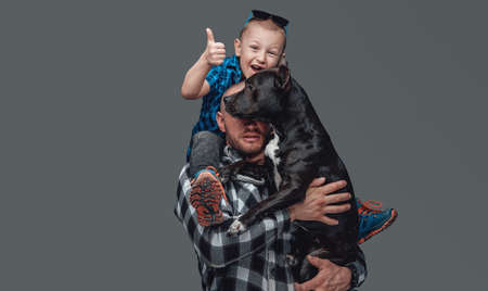 Son and dog dressed in casual clothing and dogの写真素材