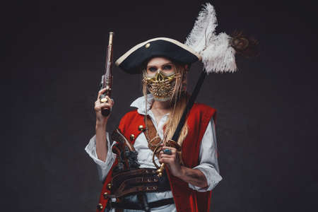 Dangerous woman corsair with golden mask and hatの写真素材