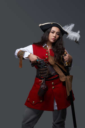Rich woman buccaneer with tricorn hat and gem ringsの写真素材