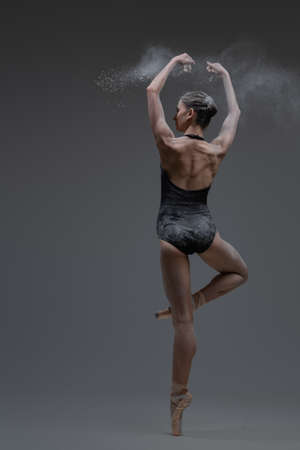 Fitness ballerina showing her perfomance inside studioの写真素材
