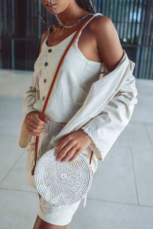 Shot of trendy clothing and handbug for summer