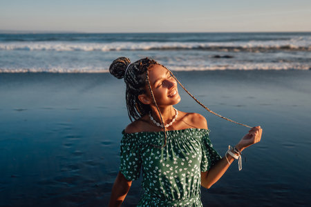 Woman with dreadlocks against beautiful seascape in bali