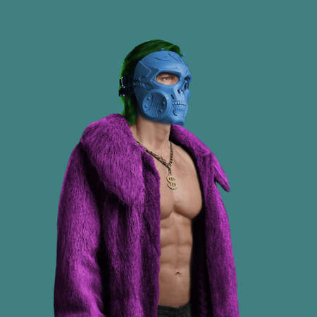 Stylish man with mask dressed in purple fur coat