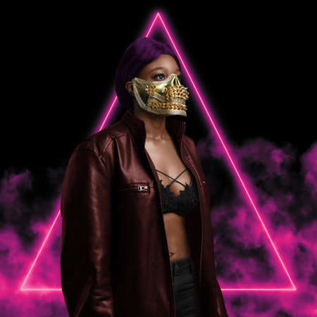 Fashionable black woman dressed in leather biker jacket