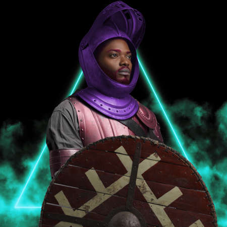 Black man with shield dressed in colorful suit and helmetの写真素材