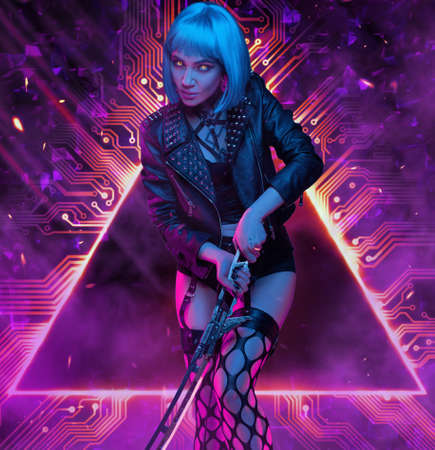 Stylish woman with sword in fight pose against abstract backgroundの写真素材