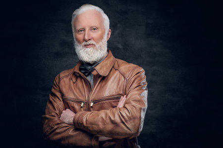 Confident elderly man dressed in brown leather jacketの写真素材