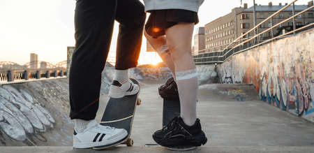 Couple of two skateboarders at skate park together