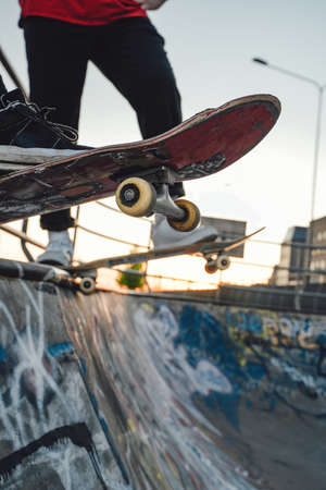 Two skateboarders at skate park in daytime outdoors