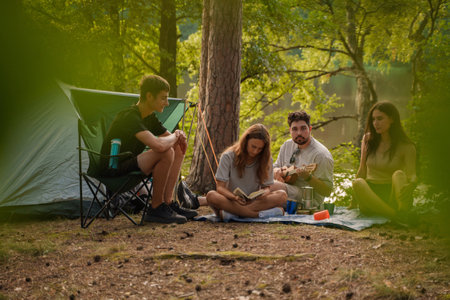 Joyful group of friends and their travel in summer forestの写真素材