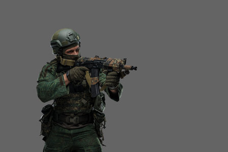 Russian soldier aiming his rifle isolated on grey background