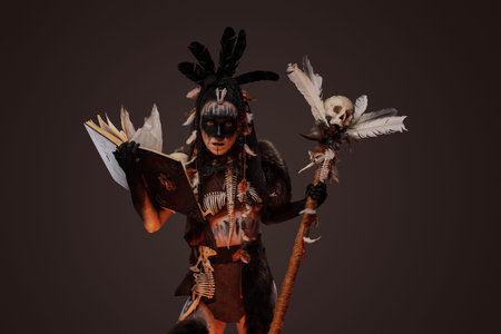 Mad necromancer with staff and book of dead