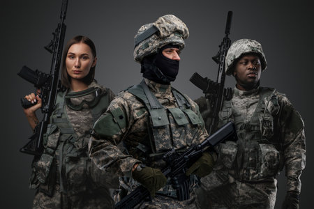 Shot of soldier with two female and male comradesの写真素材