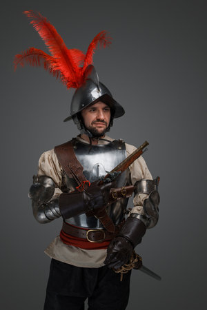 Medieval musketeer with epee and flintlock handgun