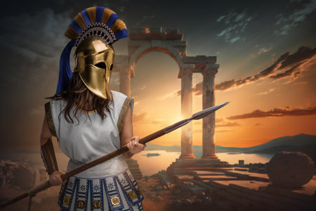 Antique warrior woman with spear against sea and buildingの写真素材