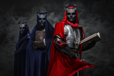 Dark cultists with robes and masks against dark background