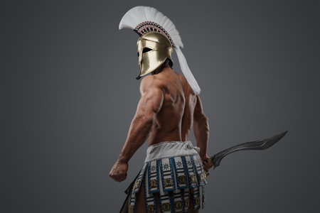 Strong greek warrior with naked torso and plumed helmetの写真素材
