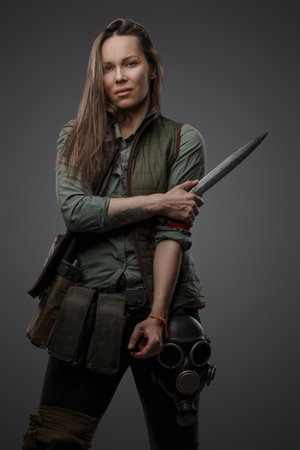 Murderer woman dressed in military uniform staring at cameraの写真素材