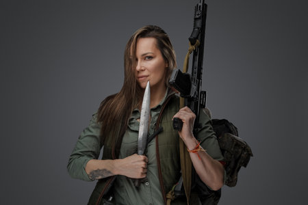 Survivor woman with knife in post apocalyptic setting