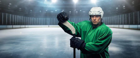 Professional hockey player with hockey stick in stadiumの写真素材