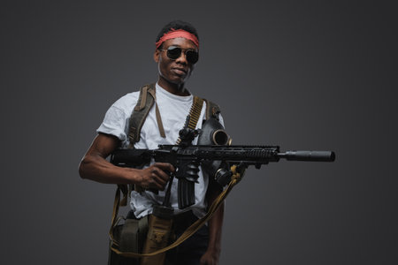 African somali pirate with sunglasses against grey backgroundの写真素材