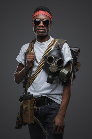 Black somali pirate with sunglasses against grey backgroundの写真素材