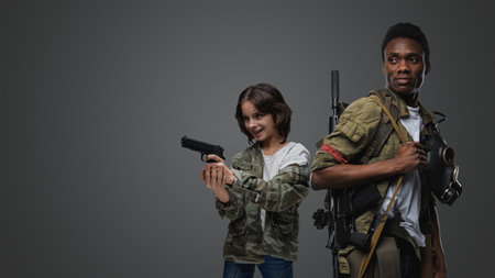 Black guy and little girl in setting of post apocalypse