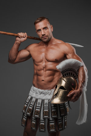 A muscular and attractive male model dressed in ancient pterugesの写真素材