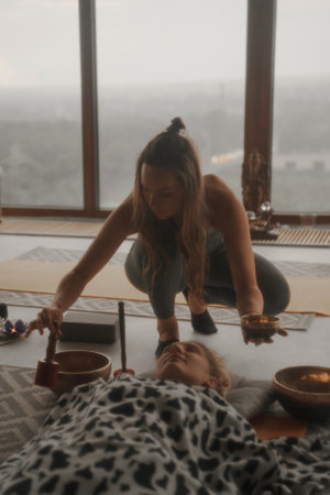 A peaceful scene of girls practicing spiritual activities and yogaの写真素材