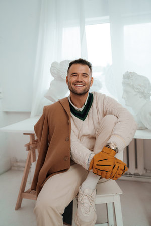 Opulently attired gentleman in old-money fashion with a captivating smileの写真素材