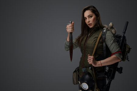 Middle eastern female survivor, dagger poseの写真素材