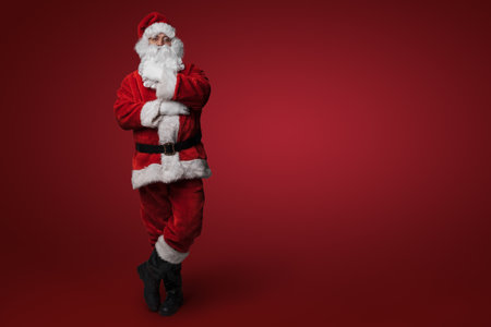 Thoughtful Santa: Pondering Christmas Eveの写真素材