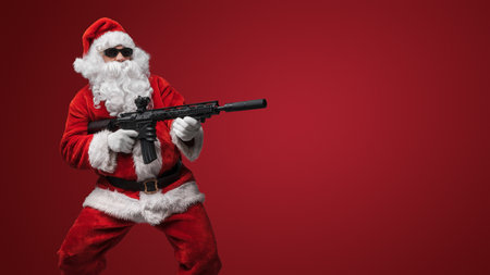 Festive Santa Claus with Toy Riflesの写真素材