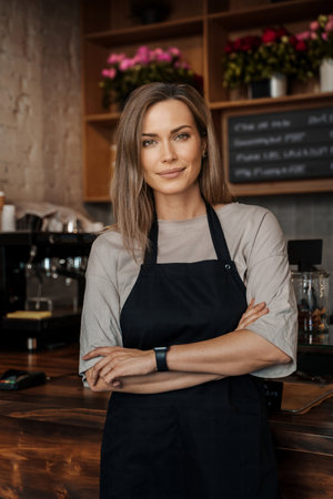 Confident Female Barista in Coffee Shopの写真素材