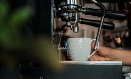 Espresso Machine Brewing Coffee into a Cupの写真素材