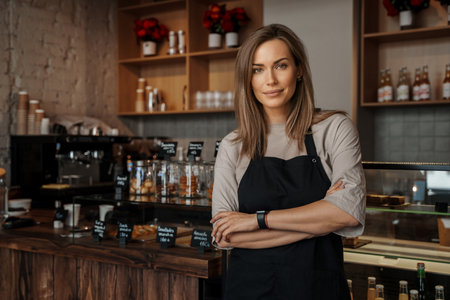 Confident Female Barista in Coffee Shopの写真素材