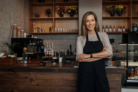 Confident Female Barista in Coffee Shopの写真素材
