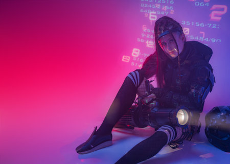 Futuristic Woman with Projector and Helmet in Digital Symbol Environmentの写真素材