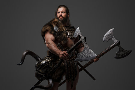 A fierce bearded Viking warrior in fur and light armorの写真素材