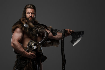 A fierce bearded Viking warrior in fur and light armorの写真素材