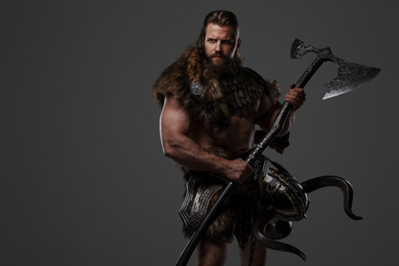 A fierce bearded Viking warrior in fur and light armorの写真素材