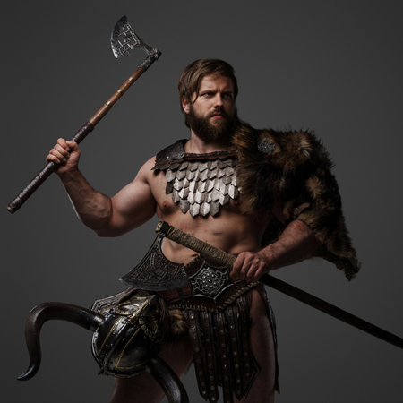 A fierce bearded Viking warrior in fur and light armorの写真素材