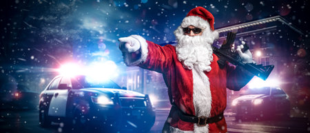 Santa Claus with Machine Gun and Police Cars in Snowstormの写真素材