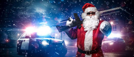 Santa Claus with Machine Gun and Police Cars in Snowstormの写真素材