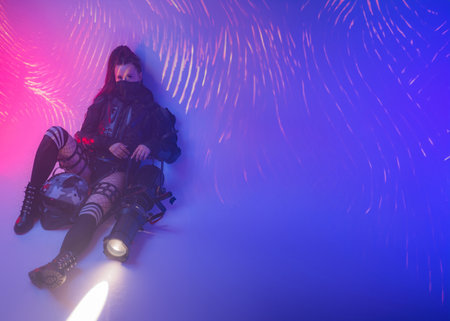 Digital Futurism: Woman in Tactical Black Suit with Open Space for Textの写真素材