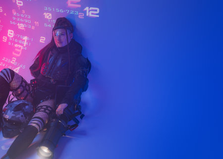 Digital Futurism: Woman in Tactical Black Suit with Open Space for Textの写真素材