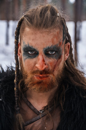 Viking Warrior with Intense Gaze and War Paintの写真素材