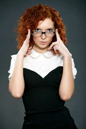 beautiful woman with red curly hairの写真素材